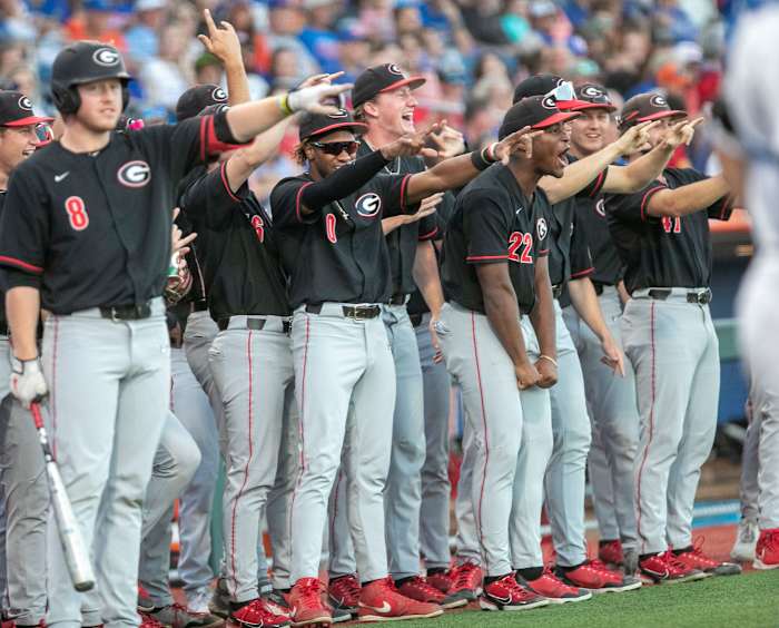 Georgia's dugout celebrates first baseman Charlie Condon's (24) home run on the Gators, Friday, April 14, 2023, at Condron Family Baseball Park in Gainesville, Florida. The Gators lost Game 1 of the weekend series to the Bulldogs 13-11. 2023 Gator Baseball April 14, 2023 Condron Family Ballpark Georgia Bulldogs. (Cyndi Chambers / USA TODAY NETWORK).